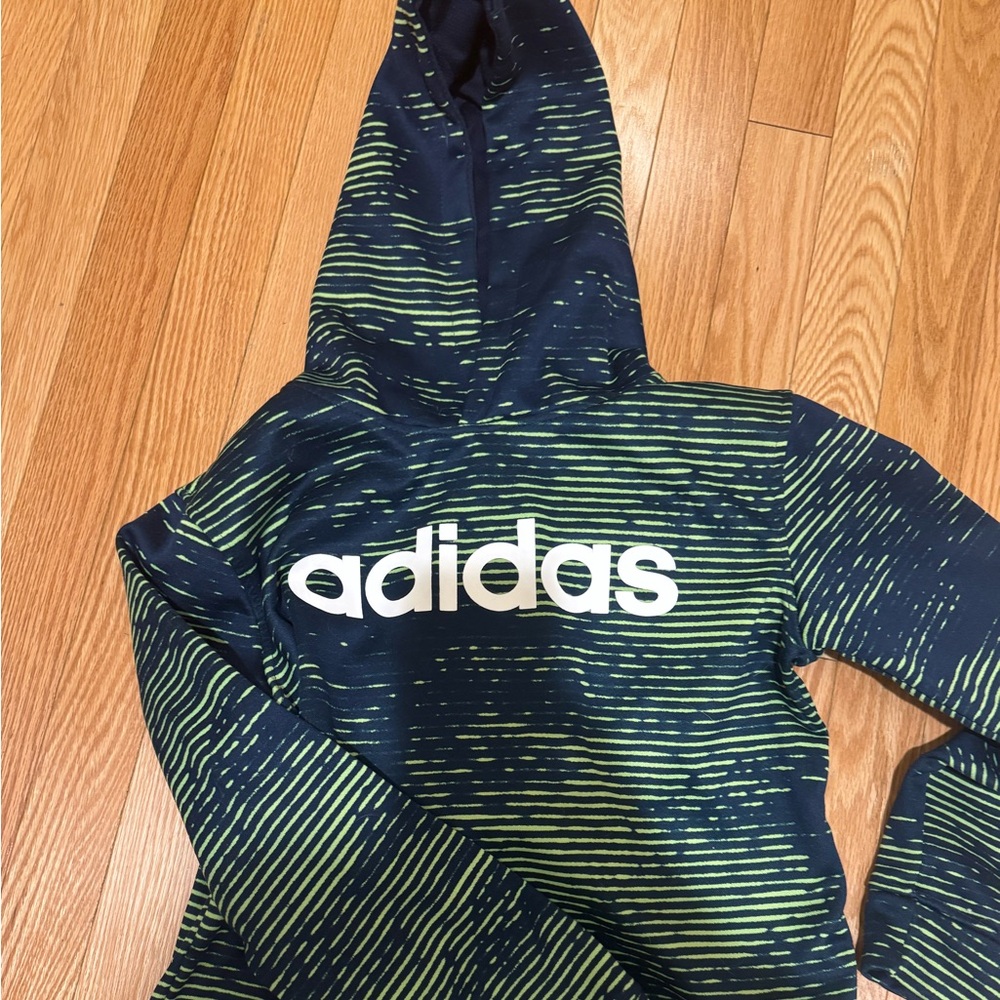 Two used Adidas sweatshirts in good condition. Size 10-12